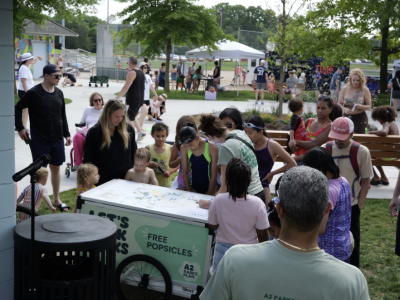 kids at a free popsicle stand